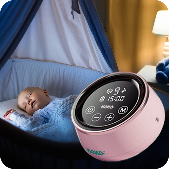 sleeping baby, next to neno Bella breast pump
